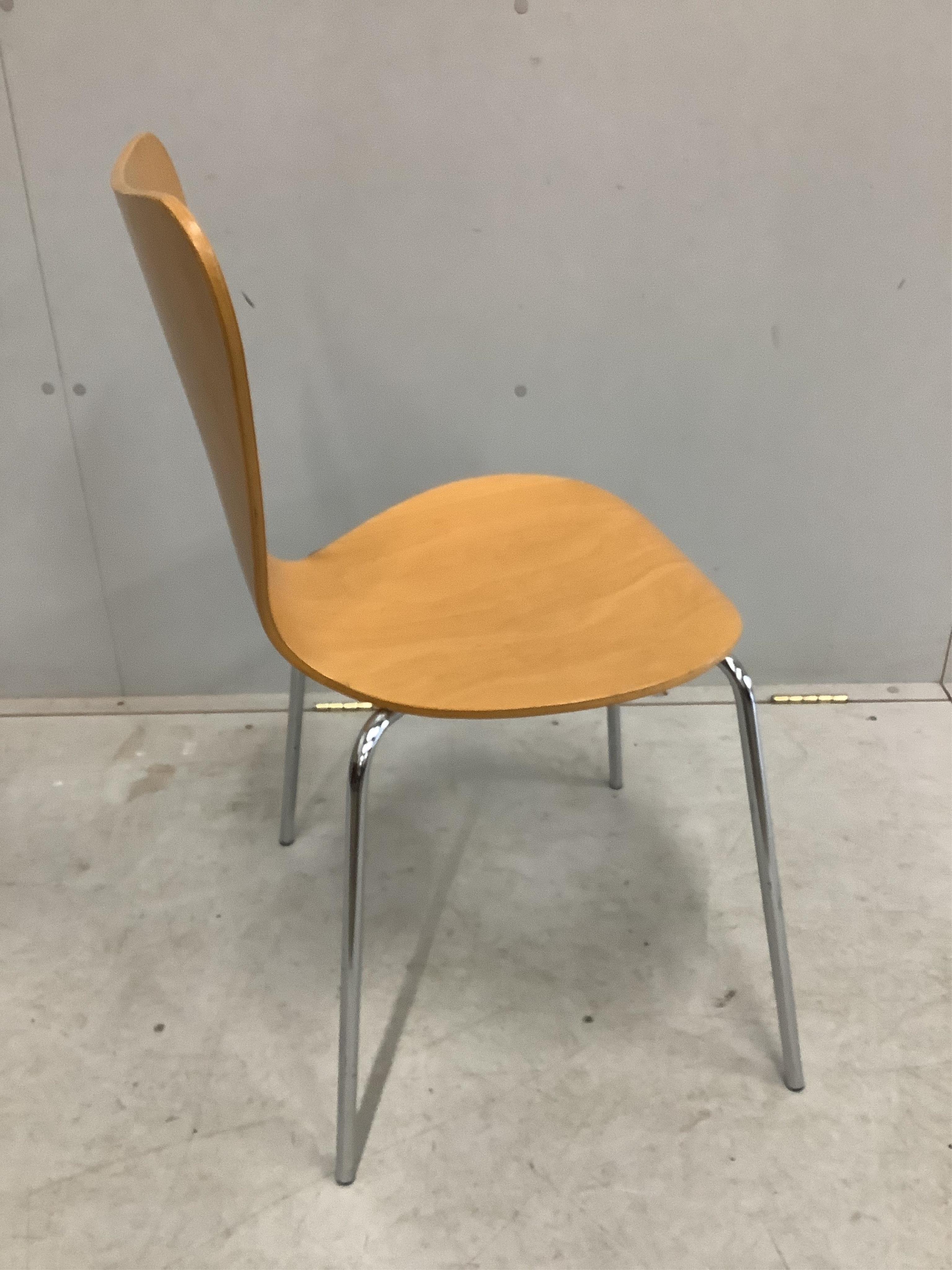 A set of four Arne Jacobsen style bent ply and chrome stacking chairs, width 45cm, depth 40cm, height 81cm. Condition - fair to good